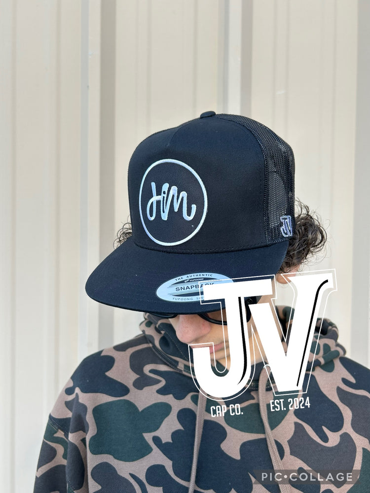 him patch on a black cap