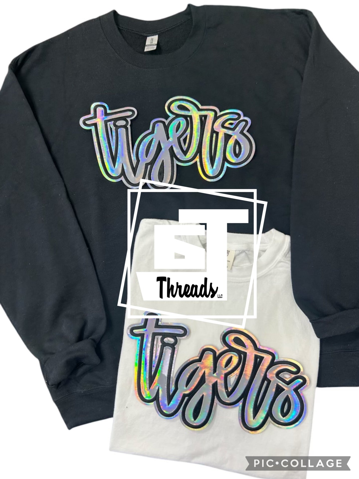 Metallic cursive, silver tigers on a black sweatshirt and a white T-shirt