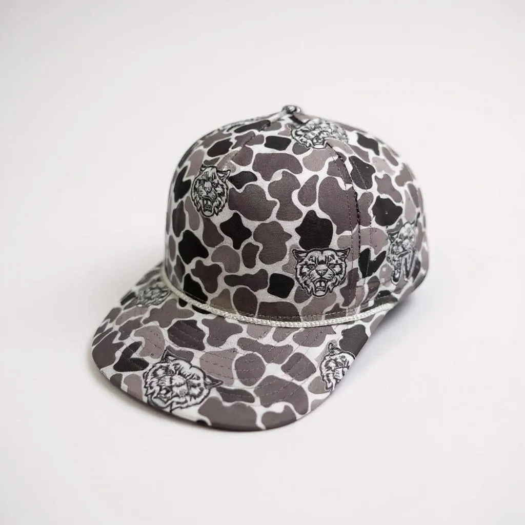 Camouflage-patterned cap with embroidered designs on a white background
