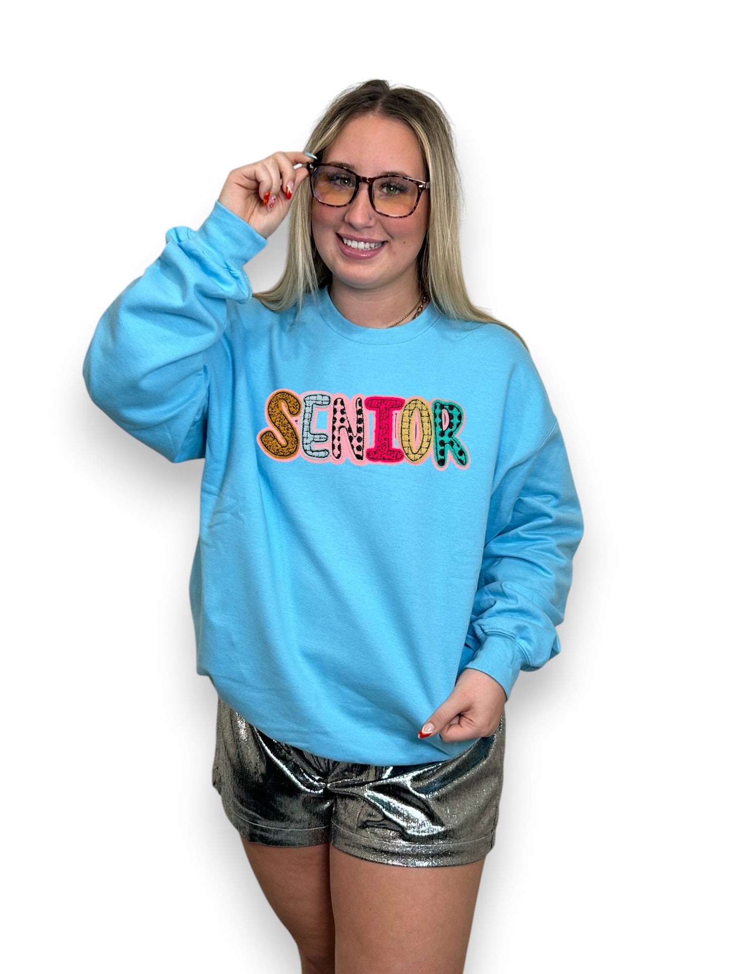 senior on blue sweatshirt