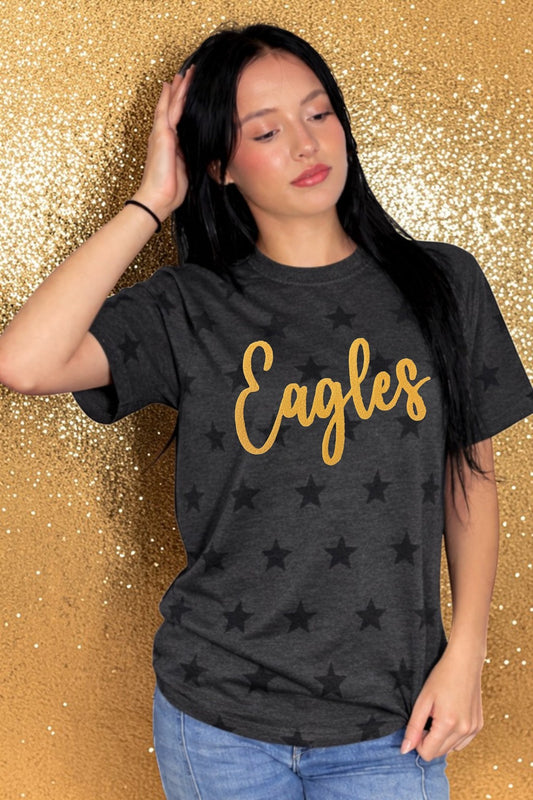 Person wearing a black t-shirt with 'Eagles' printed in gold on a glittery gold background
