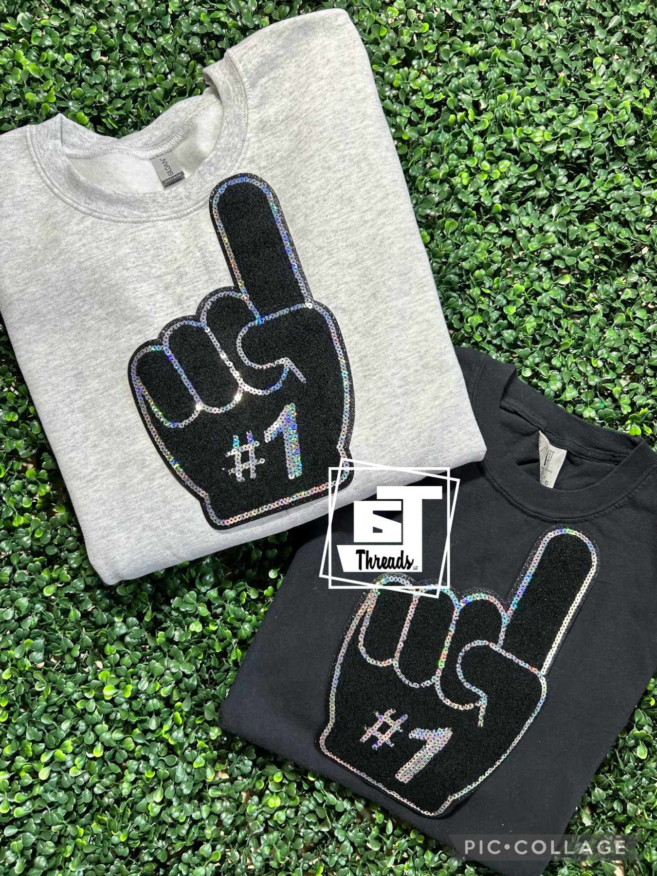 foam finger patch on gray sweatshirt and black shirt
