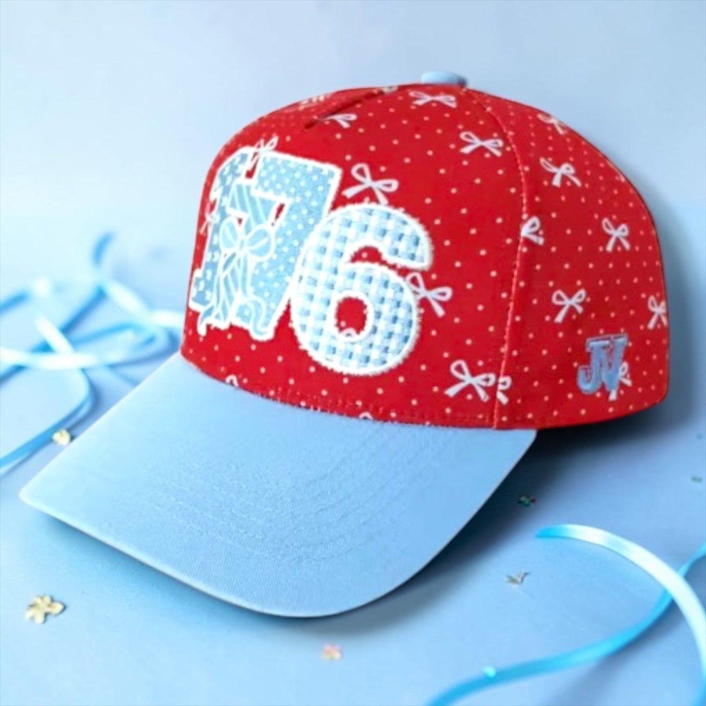Red cap with white patterns and numbers on a blue background