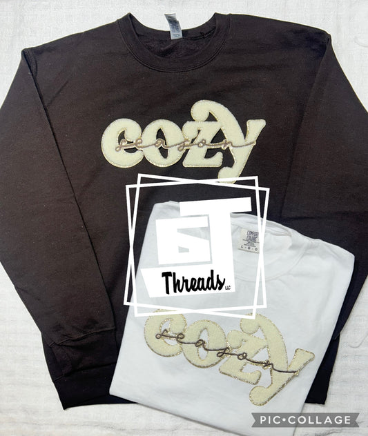 Chenille cozy season on brown crewneck and white tee shirt 