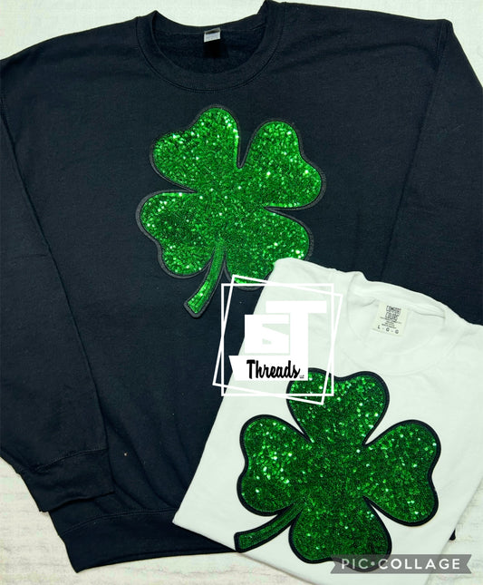 Four leaf clover on black crewneck and white tee shirt 