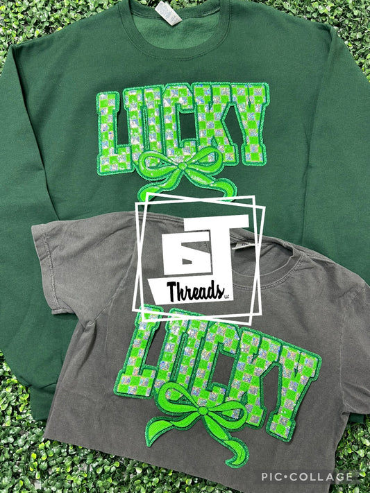 Sequins checkered, lucky patch on forest, green sweatshirt and charcoal T-shirt