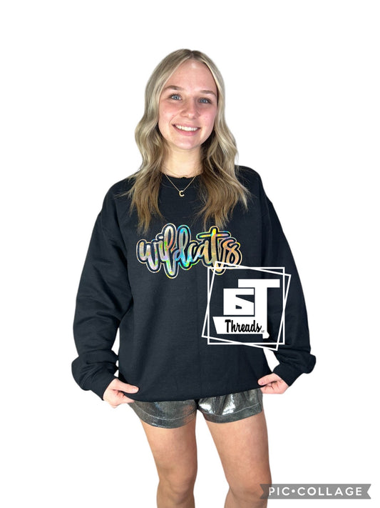 Gold metallic wildcat patch on a black sweat sweatshirt