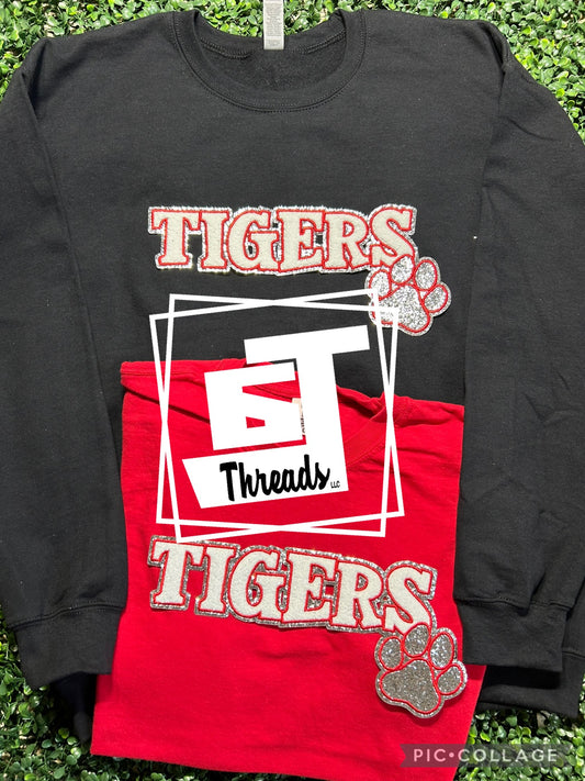 red tigers with paw with black sweatshirt and red shirt