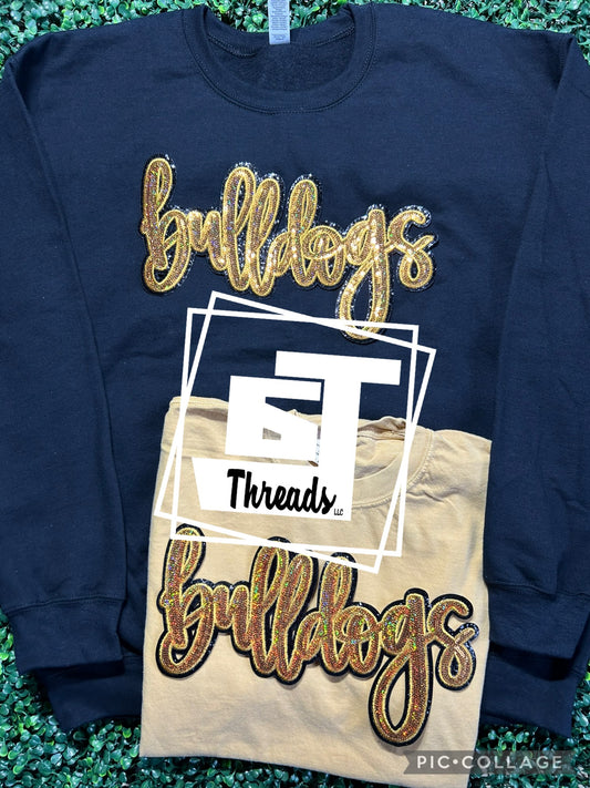 gold cursive sequin bulldogs patch on black sweatshirt and gold shirt