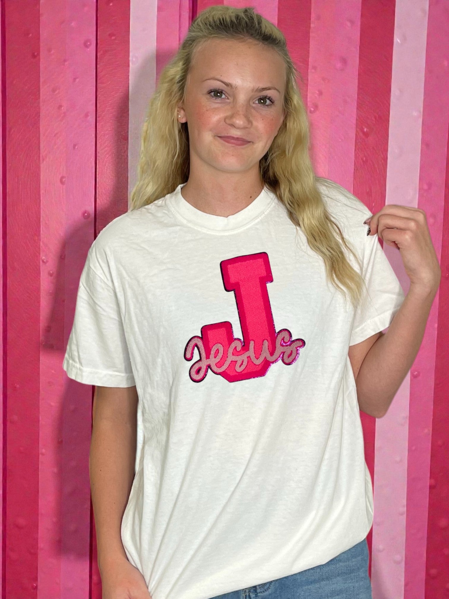 Pink jesus patch on a t-shirt