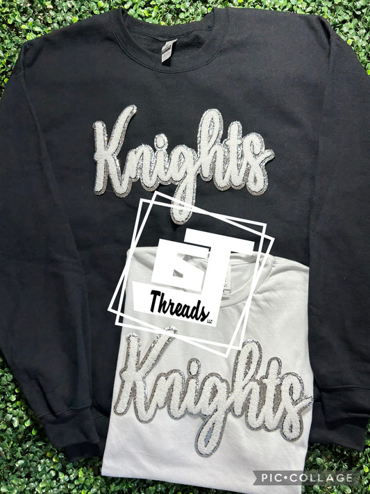 cursive chenille knights patch on black sweatshirt and white shirt