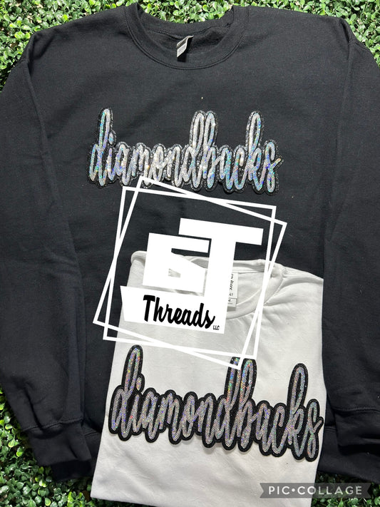 cursive sequin diamondbacks patch on black sweatshirt and white shirt