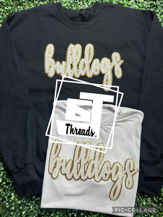 white and gold cursive sequin bulldogs black sweatshirt and white shirt