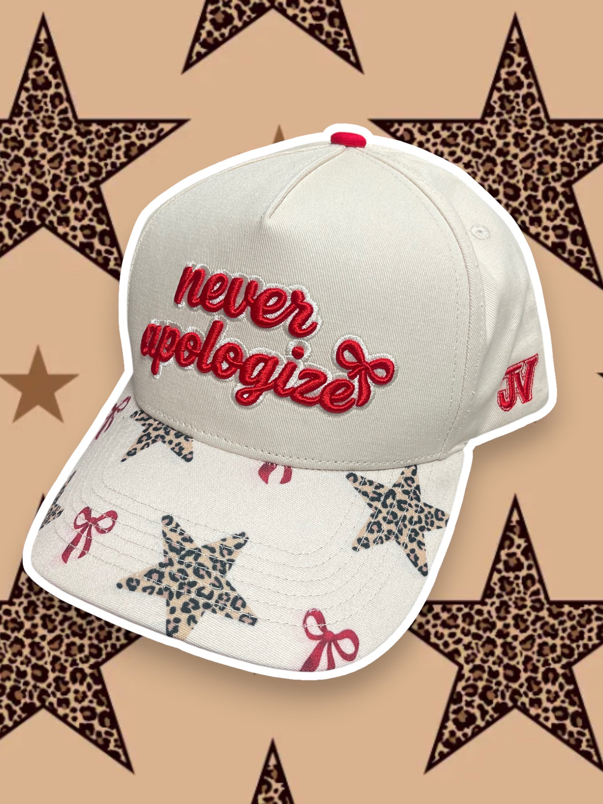 Cap with 'never apologize' text on a star-patterned background