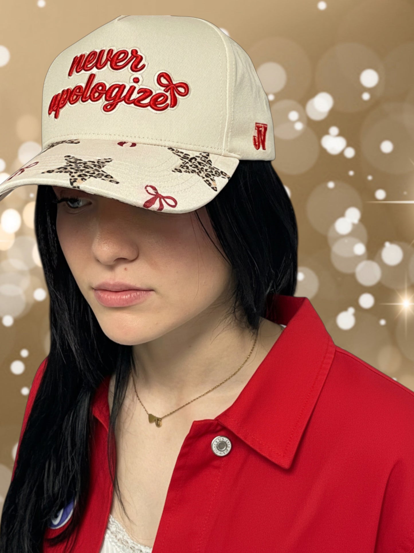 Person wearing a cap with 'never apologize' text on a blurred background