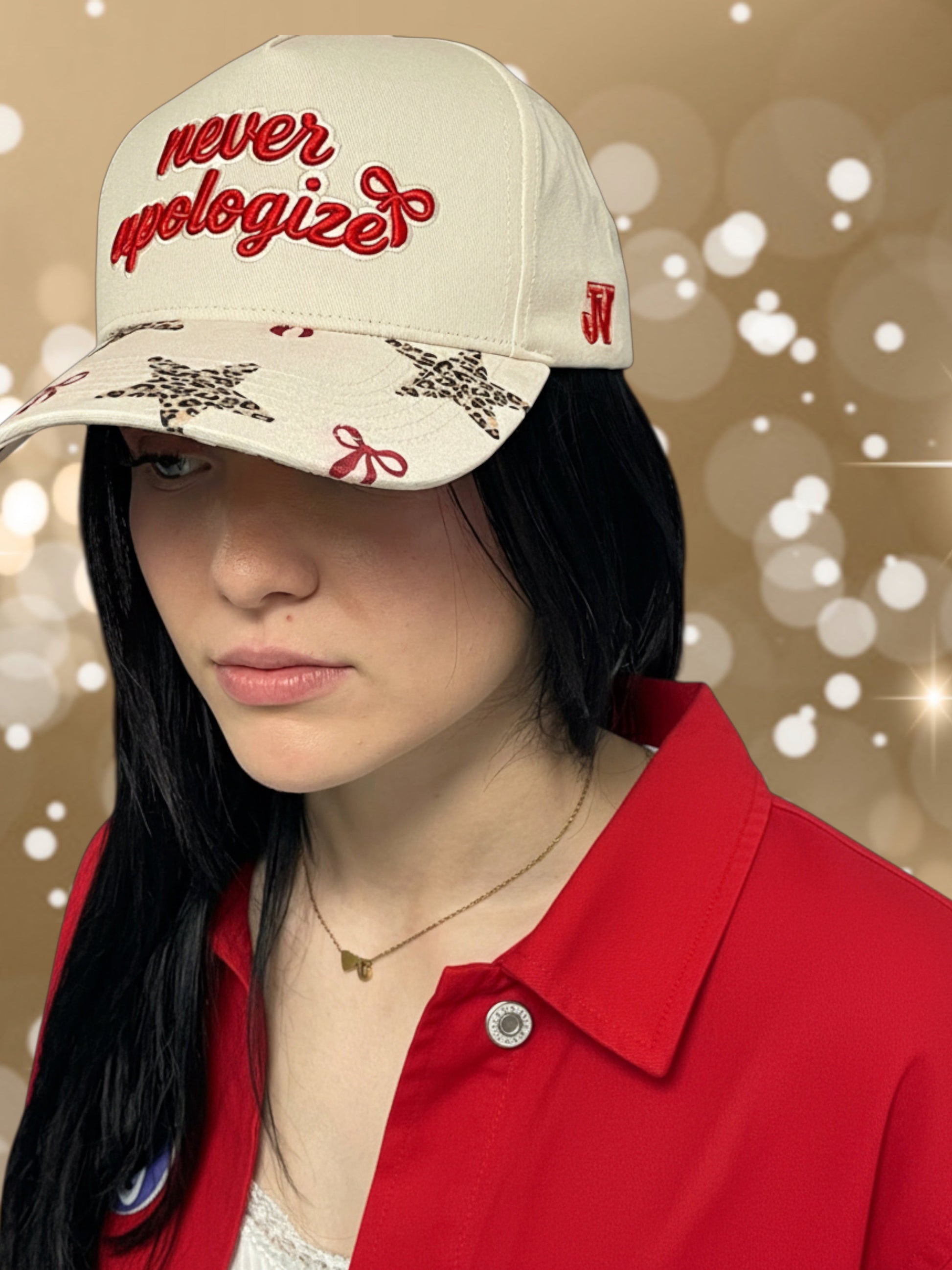 Person wearing a cap with 'never apologize' text on a blurred background